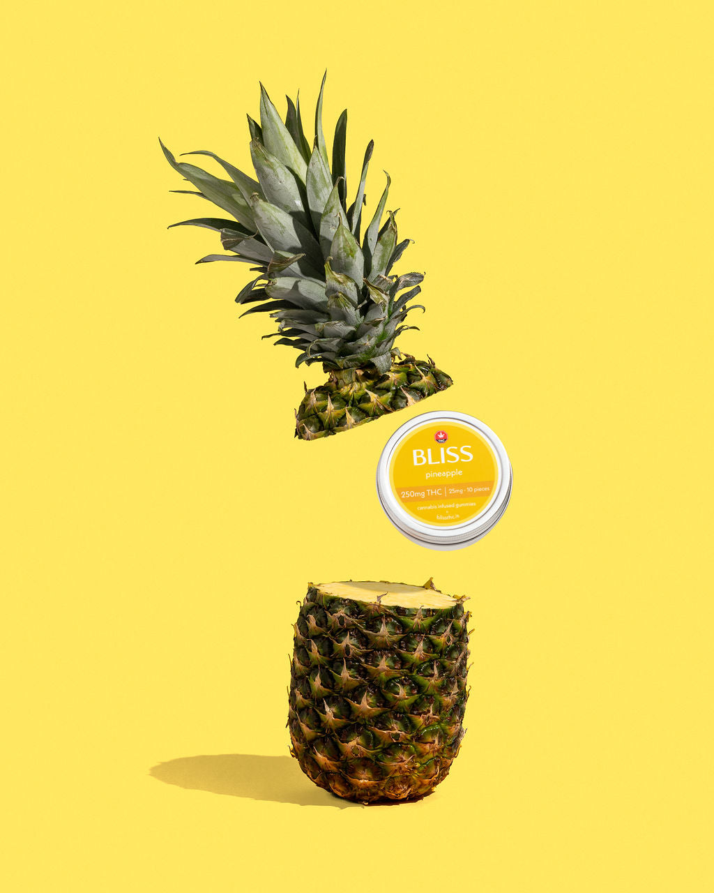 Bliss Gummies product photography with a pineapple